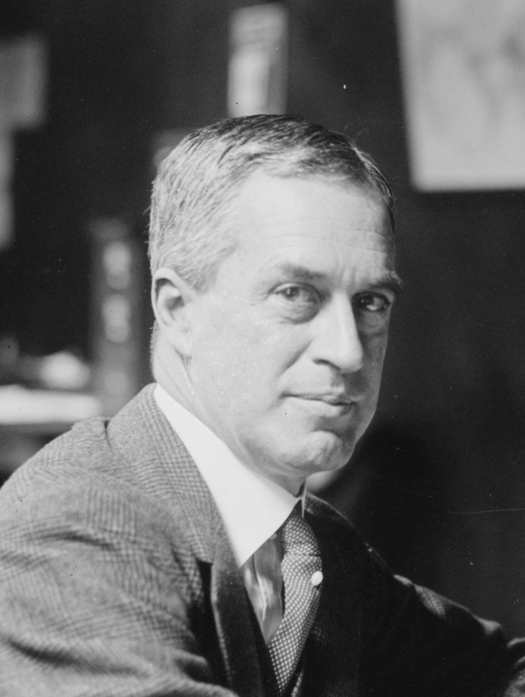 Black and white photograph of Arthur Woods wearing a suit and looking at the camera