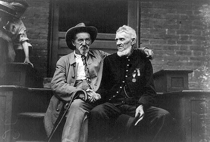 Black and white photograph of two men, one in Union uniform and one in Confederate uniform, shaking hands