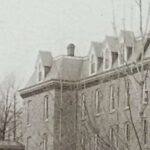 Black and white photograph of two buildings